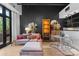 Cozy living room with a plush sofa, decorative shelving, and access to natural light, offering a comfortable and stylish atmosphere at 720 Governor Morrison St # 219, Charlotte, NC 28211