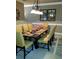 Cozy dining room featuring a chandelier, neutral paint, and a decorative wall mirror at 9177 Bonnie Briar Cir, Charlotte, NC 28277