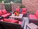 Outdoor patio with stylish patio seating and brick walls with iron gate at 9177 Bonnie Briar Cir, Charlotte, NC 28277
