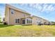 Spacious backyard showcasing vinyl siding and manicured lawn on a sunny day at 10004 Perth Moor Rd, Charlotte, NC 28278