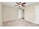 Comfortable bedroom with neutral paint, ceiling fan, and soft carpet at 10004 Perth Moor Rd, Charlotte, NC 28278