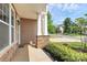 Inviting front porch featuring stone accents, a well-manicured garden, and a welcoming entrance at 10004 Perth Moor Rd, Charlotte, NC 28278