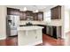 Modern kitchen featuring stainless steel appliances, granite countertops, and a kitchen island at 10004 Perth Moor Rd, Charlotte, NC 28278