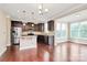 Open concept kitchen featuring granite countertops and stainless steel appliances at 10004 Perth Moor Rd, Charlotte, NC 28278
