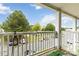 Balcony overlooking parking area with green trees in the background at 1108 Plaza Walk Dr, Charlotte, NC 28215