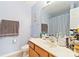 A full bathroom with a single sink vanity and blue and white checkered shower curtain at 1108 Plaza Walk Dr, Charlotte, NC 28215