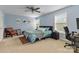 Bedroom with cool blue walls, a ceiling fan, and a workspace area at 1108 Plaza Walk Dr, Charlotte, NC 28215