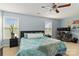 Bedroom featuring blue walls, a ceiling fan, and a comfortable work space at 1108 Plaza Walk Dr, Charlotte, NC 28215