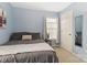 Cozy bedroom with light blue walls and view of window at 1108 Plaza Walk Dr, Charlotte, NC 28215