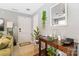 Inviting entryway featuring a console table with decorative accents and plants at 1108 Plaza Walk Dr, Charlotte, NC 28215