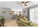 Bright living room with an open layout, seamlessly flowing into the dining area at 1108 Plaza Walk Dr, Charlotte, NC 28215