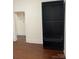 Bedroom featuring wooden floor and a built-in closet for storage at 1126 Clement Ave, Charlotte, NC 28205