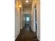 Hallway with wooden floors and vintage white wood doors that lead to other rooms at 1126 Clement Ave, Charlotte, NC 28205