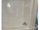 Close up of a clean bathtub with a curved design, ready for relaxation and comfort at 1201 Forest Ridge Rd, Bessemer City, NC 28016