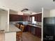 Well-equipped kitchen featuring granite countertops, dark cabinets and stainless steel appliances at 1201 Forest Ridge Rd, Bessemer City, NC 28016