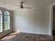Bright living space featuring hardwood floors and a modern ceiling fan at 1201 Forest Ridge Rd, Bessemer City, NC 28016