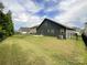 Well-maintained backyard with lush green lawn and black fence, showcasing outdoor living space at 1211 Calder Dr, Indian Trail, NC 28079