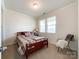 Comfortable bedroom featuring natural light, neutral paint, and a carpeted floor at 1211 Calder Dr, Indian Trail, NC 28079