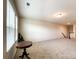 Spacious carpeted bonus room with neutral walls, large windows, and ample natural light at 1211 Calder Dr, Indian Trail, NC 28079