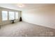 Spacious carpeted bonus room with ample natural light, perfect for versatile living at 1211 Calder Dr, Indian Trail, NC 28079