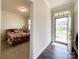 View of the entryway into a bedroom featuring carpet, a window, and a bed at 1211 Calder Dr, Indian Trail, NC 28079