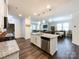 View from the kitchen island of the connected living and dining areas at 1211 Calder Dr, Indian Trail, NC 28079