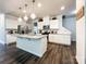 Bright, stylish kitchen with granite countertops, stainless appliances, and modern lighting at 1211 Calder Dr, Indian Trail, NC 28079