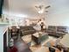 Open-concept living room with dark wood floors flows into dining and kitchen area at 1211 Calder Dr, Indian Trail, NC 28079