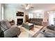 Spacious living area with fireplace offers comfortable seating and bright, neutral decor at 1211 Calder Dr, Indian Trail, NC 28079