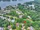 Aerial view of property showcasing the home, surrounding community, and nearby lake access at 14203 Queens Carriage Pl, Charlotte, NC 28278