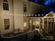 Back porch and deck with string lights providing a great place to enjoy the outdoors at 14203 Queens Carriage Pl, Charlotte, NC 28278