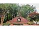 Welcoming brick entrance sign for Harbor Club community with lush landscaping at 14203 Queens Carriage Pl, Charlotte, NC 28278