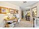 Hallway with a desk and gallery wall that opens to a playful nook, all filled with natural light at 14203 Queens Carriage Pl, Charlotte, NC 28278