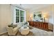 Cozy living room featuring neutral tones, a large window, and traditional furnishings at 14203 Queens Carriage Pl, Charlotte, NC 28278