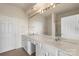 Bathroom with a double sink vanity, large mirror, and good lighting at 14347 San Paolo Ln, Charlotte, NC 28277