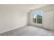 Bright bedroom with a large window offering natural light and neutral carpet at 14347 San Paolo Ln, Charlotte, NC 28277