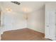Dining area featuring hardwood floors, chandelier, and access to the door, creating a welcoming space at 14347 San Paolo Ln, Charlotte, NC 28277