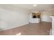 Open-concept space with fireplace and open kitchen at 14347 San Paolo Ln, Charlotte, NC 28277