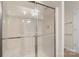Clean shower with sliding glass door and neutral wall color at 14347 San Paolo Ln, Charlotte, NC 28277