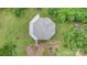 Overhead shot of the octagonal home on a grassy lot surrounded by trees and meticulous landscaping at 147 Buck And Doe Ln, Statesville, NC 28625
