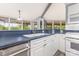 Well-lit kitchen featuring white cabinets, modern appliances, and countertops at 147 Buck And Doe Ln, Statesville, NC 28625