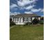 The home's lush backyard features a concrete patio and beautiful landscaping at 15116 Legend Oaks Ct, Fort Mill, SC 29707