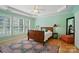 Bright bedroom with tray ceilings, hardwood floors and large window at 15116 Legend Oaks Ct, Fort Mill, SC 29707