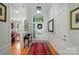 Elegant foyer with hardwood floors, stylish lighting, and a welcoming entryway decor at 15116 Legend Oaks Ct, Fort Mill, SC 29707