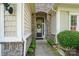 Inviting front entrance with stone accents and a decorative wreath welcoming you home at 15116 Legend Oaks Ct, Fort Mill, SC 29707