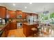 Spacious kitchen featuring stainless steel appliances, a central island, and a cozy breakfast nook at 15116 Legend Oaks Ct, Fort Mill, SC 29707