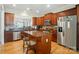 Well-equipped kitchen with stainless steel appliances, a central island, and hardwood floors at 15116 Legend Oaks Ct, Fort Mill, SC 29707