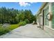 View of an outdoor patio with seating, greenery, and natural light at 15116 Legend Oaks Ct, Fort Mill, SC 29707
