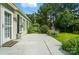Outdoor patio features a gray surface, leading to a well-maintained yard at 15116 Legend Oaks Ct, Fort Mill, SC 29707