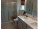 Bright bathroom featuring a glass shower, neutral tile and a vanity with a stone countertop at 15250 Windward Ln, Lancaster, SC 29720